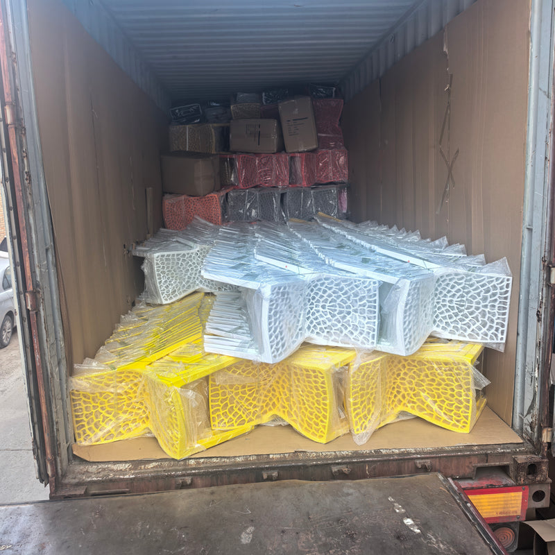 Rear view — mixed cargo: chairs, bedding, cartons, all strapped