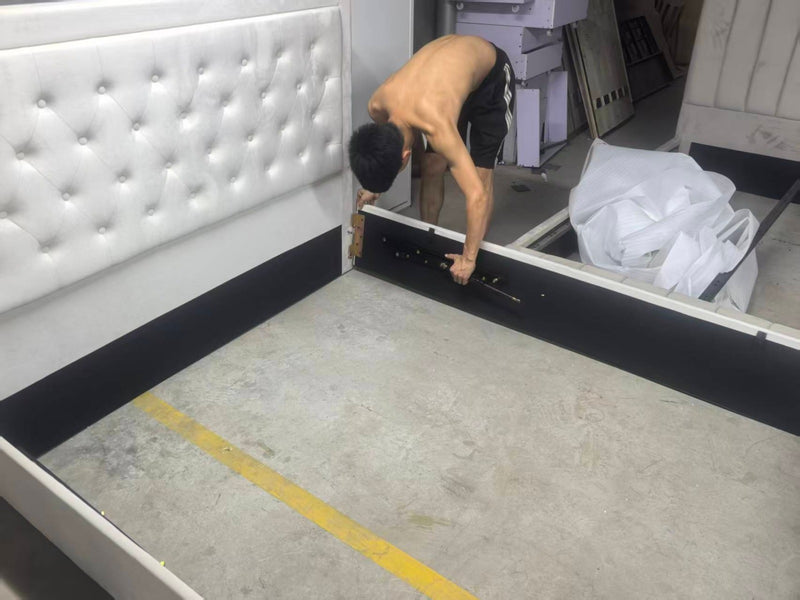 Assembly test — gas-lift strut being attached to the side rail, where the bracket jammed